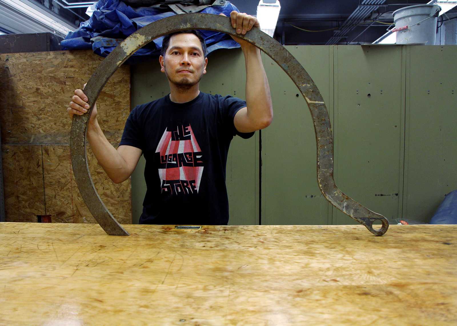 Professor Arcega stands with a sculpting tool in the sculpting lab at San Francisco State on Thursday, August 22nd. Arcega is a new professor part of the art department teaching Sculpting 1 and 2 this semester. Photo by Gavin McIntyre / Xpress