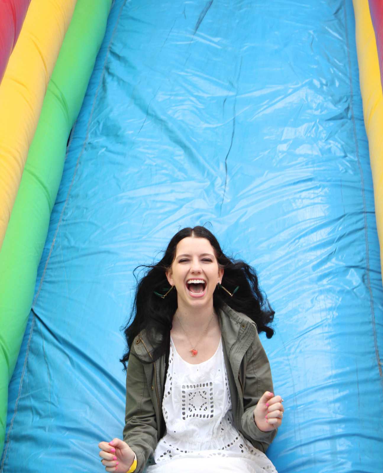Nicole Santoni, Sophomore, slides down an inflatable slide at the SF State ASI Kick-Off on Wednesday, Sept. 4, 2013. The Kick-Off was carnival themed, having ring toss, cotton candy, inflatable slides and other carnival classics. Photo Ryan Leibrich / Xpress