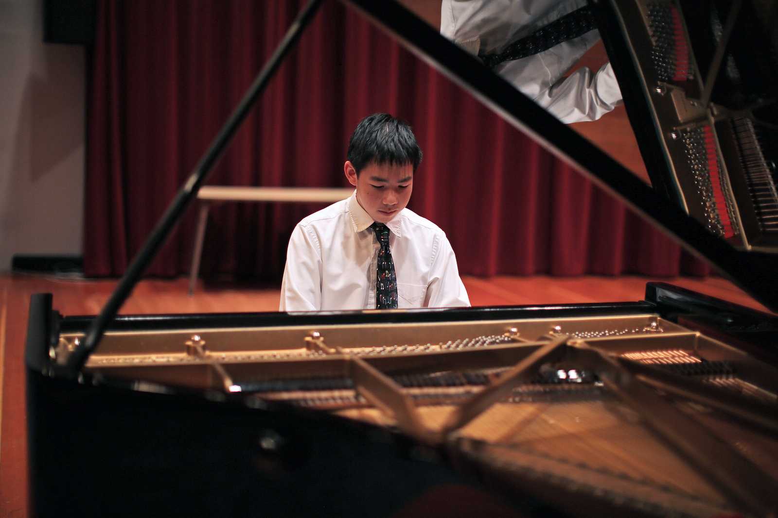 Alex Chien, one of the winners of the San Francisco Young Pianist Competition, warms up before a performance in Knuth Hall on Sept 6. Photo by John Ornelas / Xpress