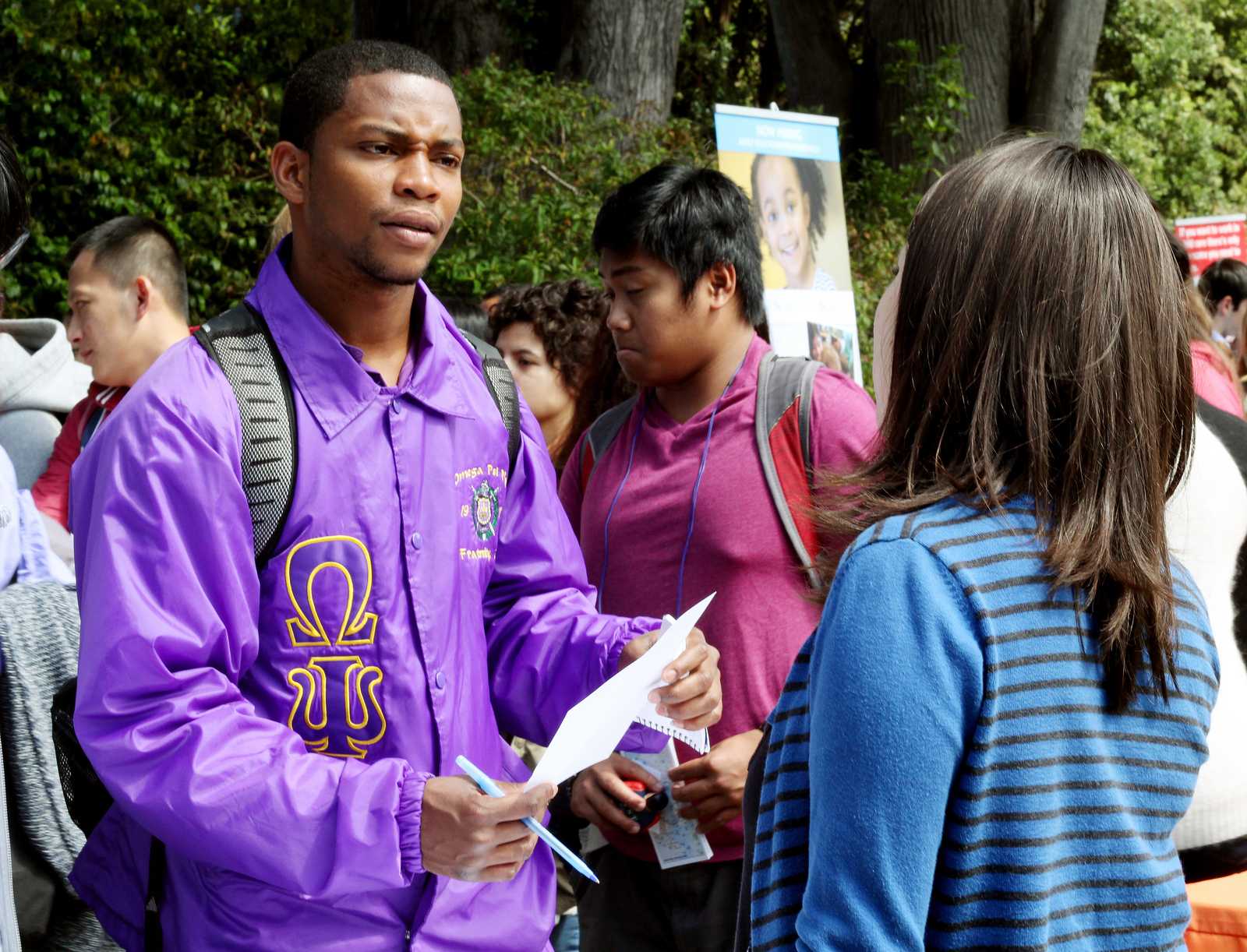 Shawn McGriff (left), a Liberal Studies major, speaks to Zoila Baltodano, the business office manager at Cesar Chavez Student Center, at a Part-Time Job Fair held in the quad at SF State, on Sept. 12, 2013. The event was put together by the Student Involvement and Career Center as a for students to meet on and off campus employers offering part-time positions. Photo by Gavin McIntyre / Xpress