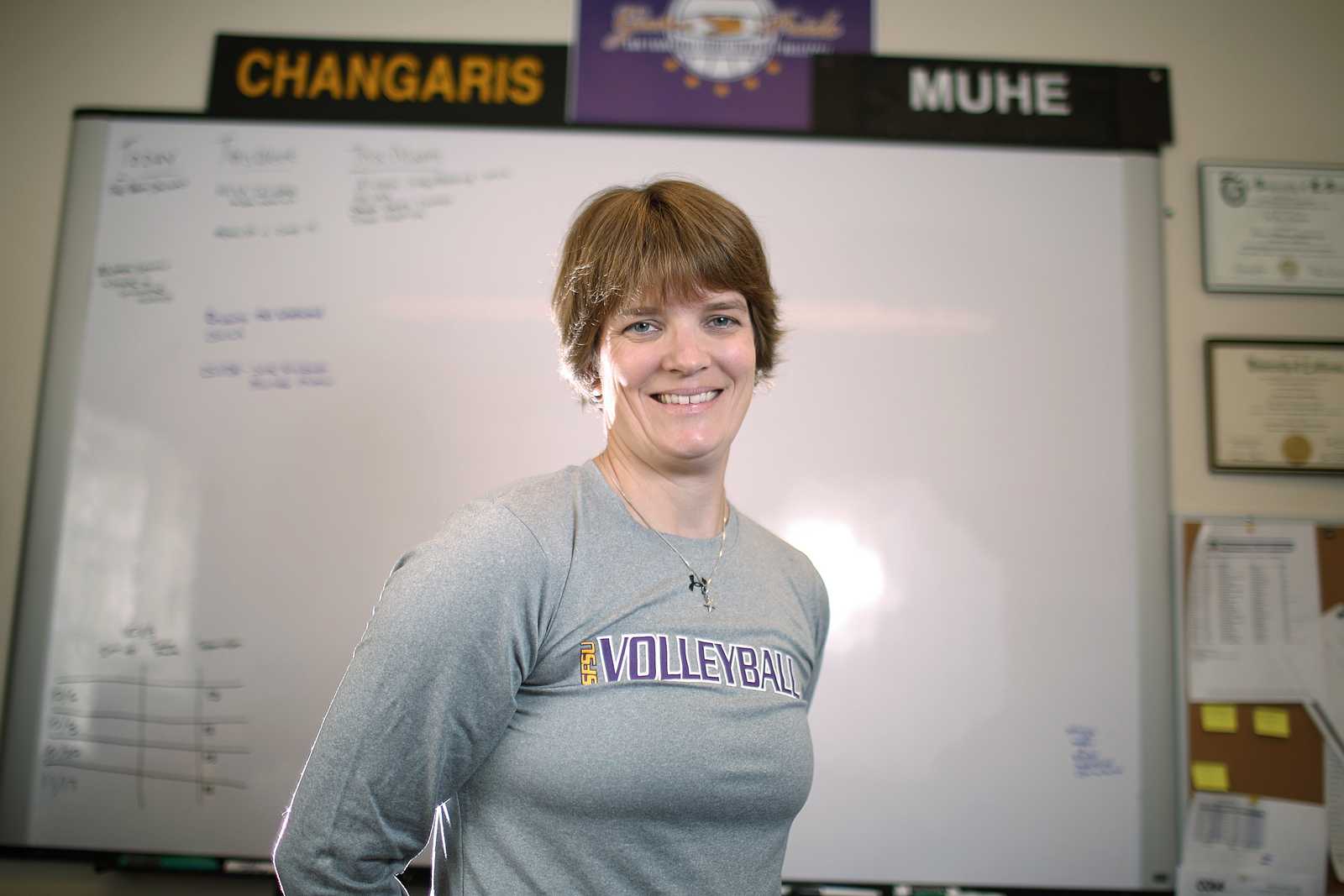 Jill Muhe, new head coach for the SF State women's volleyball team, stands in her office in the Gymnasium of SF State. Muhe recently came to SF State from Briar Cliff University in Iowa.  Photo by John Ornelas / Xpress