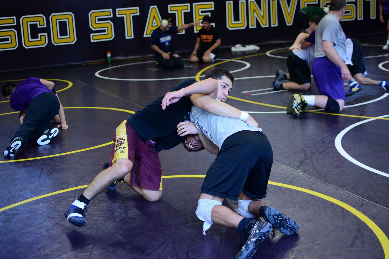 Senior Isaiah Hurtado (left), wrestles with senior Alex Williams (right), during practice at SF State on Friday, Oct. 11, 2013. Photo by Philip Houston / Xpress
