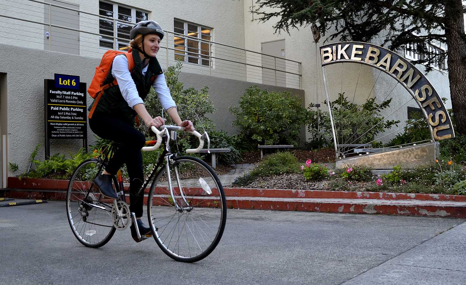 Laura Melroy 25-years-old a grad student biology major (MS ecology evolution conservation) rides out of the Bike Barn at SF State towards the nearest bike path, Thursday, Oct. 31, 2013. Four new sustainability courses are coming to SF State, one of them is called Bicycle Geographies starting in the Spring of 2014 about alternative transportation, bicycles and bike paths and more. Photo by Amanda Peterson / Xpress 