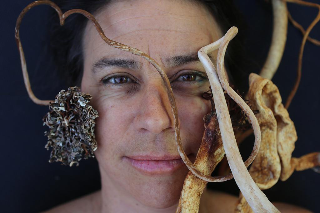 Josie Iselin, a photographer, artist, and book designer makes intimate portraits of seaweed, trash, stones, and just about anything she finds at the beach by scanning them. Photo by Rachel Aston / Xpress. 