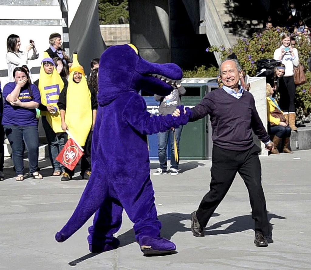 University President Leslie E. Wong dances with the SF State gator mascot at Malcolm X Plaza on Friday, Feb. 22, 2013 in preparation for the second SF State Harlem Shake video. Photo by Virginia Tieman / Xpress, 2013