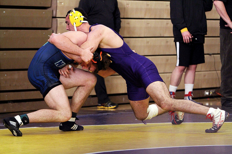 SF States Andrew Reggi wrestles Oregon States Nate Keeve at the California Collegiate Open, which was held in SF States Main Gymnasium, Saturday, Feb. 1, 2014. Reggi won the match 8-3 but wouldnt advance any further due to an injury. Photo by Gavin McIntyre / Xpress