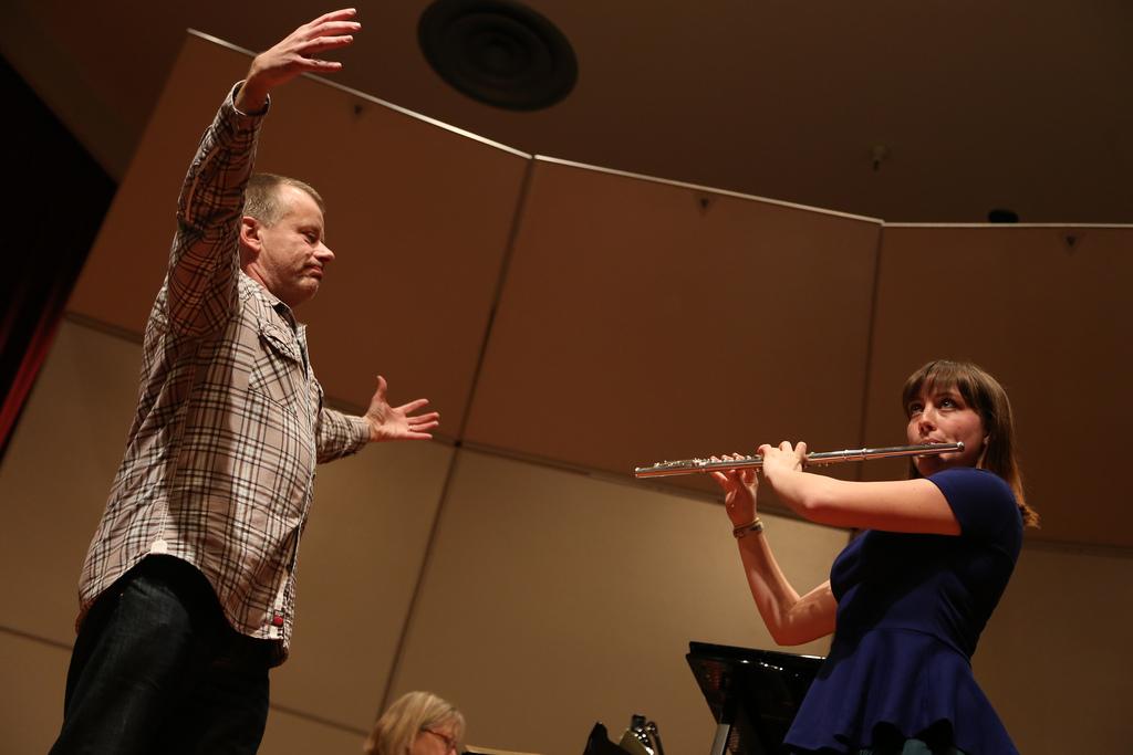 Michael Hasel, flute player for the Berlin Philharmonic Wind Quintet, instructs SF State student and flute player Abigail Green to breath deeper, connect with the audience, and have better posture during a Masterclass session in Knuth Hall in the Creative Arts building Friday Feb. 28. "You have all the tools in your toolbox, you just have to use them," he said. Photo by Rachel Aston / Xpress