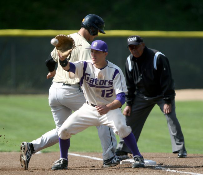 SF State's Garrett Heisinger is late to catch the ball as Cal State L.A. Manny Acosta makes it back to first during the Gators game against the Golden Eagles, at SF State's Maloney Field Sunday, April 13. Photo by Gavin McIntyre / Xpress