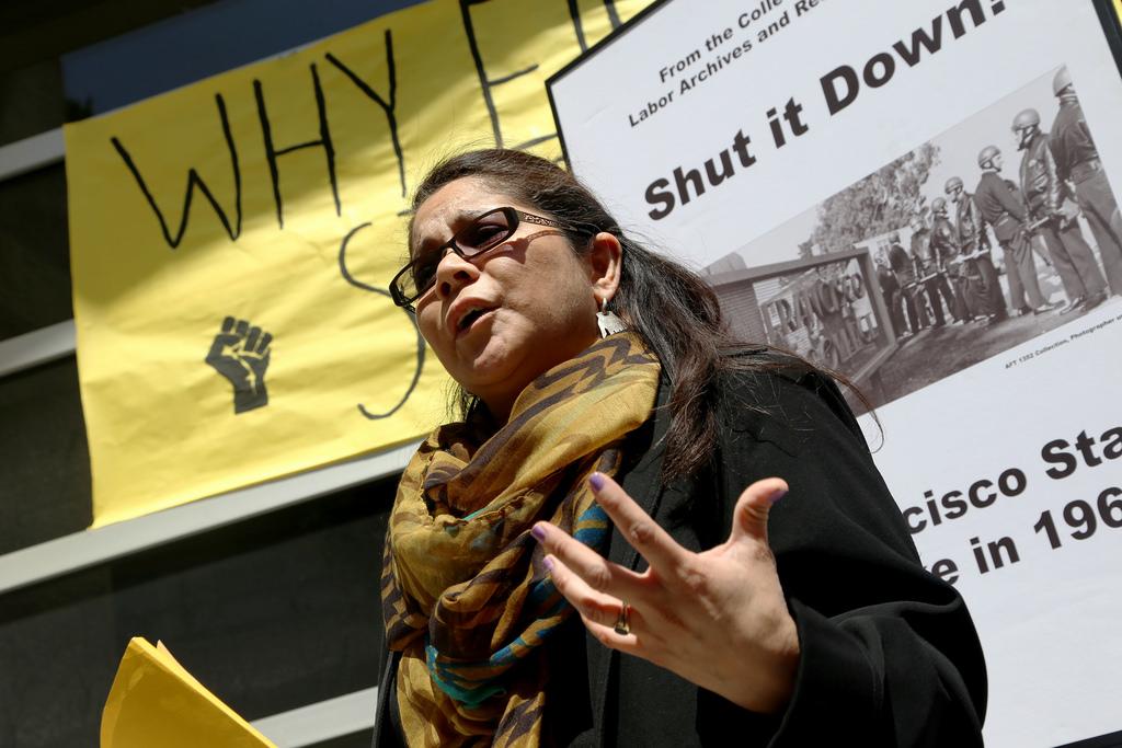 Gabriela Segovia McGahan, an administrative analyst specialist of American Indian Studies, speaks to the crowd at a demonstration to bring attention to the impending budget cuts to the Ethnic Studies department in front of the Ethnic Studies building Wednesday, April 23. Photo by Rachel Aston / Xpress