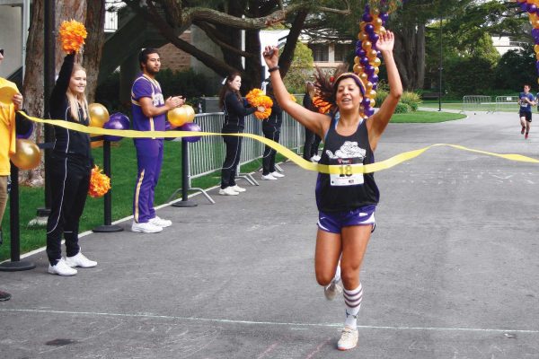 Cynthia Salazar was the first for women to cross the finish line at SF State's 5K Walk, Run & Roll Sunday, April 13. Photo by Coburn Palmer / Special to Xpress