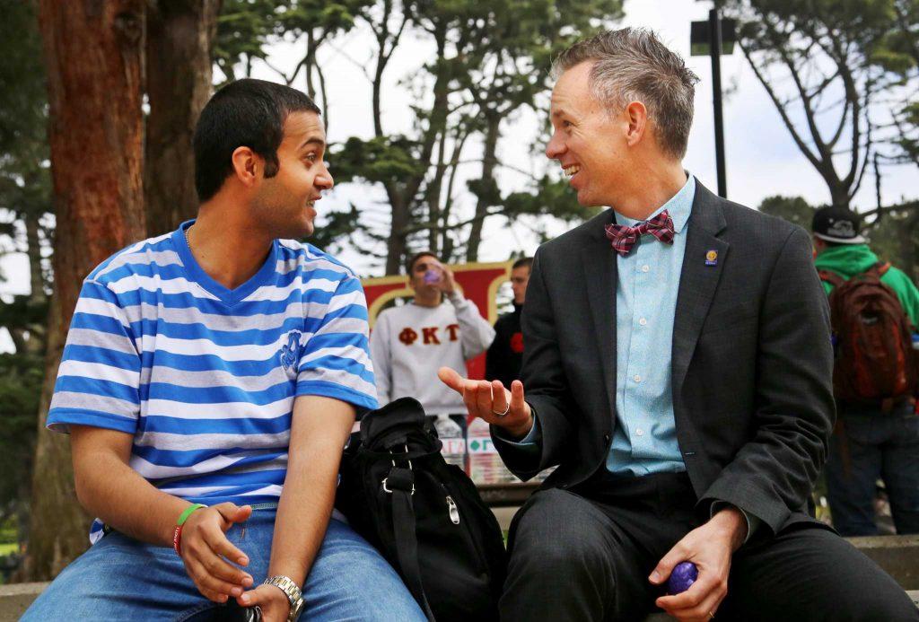 Joseph Greenwell, Dean of Students, talks with Jebril Fayyad, founder and president of United People for Peace, at SF States Accessible Adventures Day held in Malcolm X Plaza Tuesday, April 15. Photo by Jenny Sokolova / Xpress