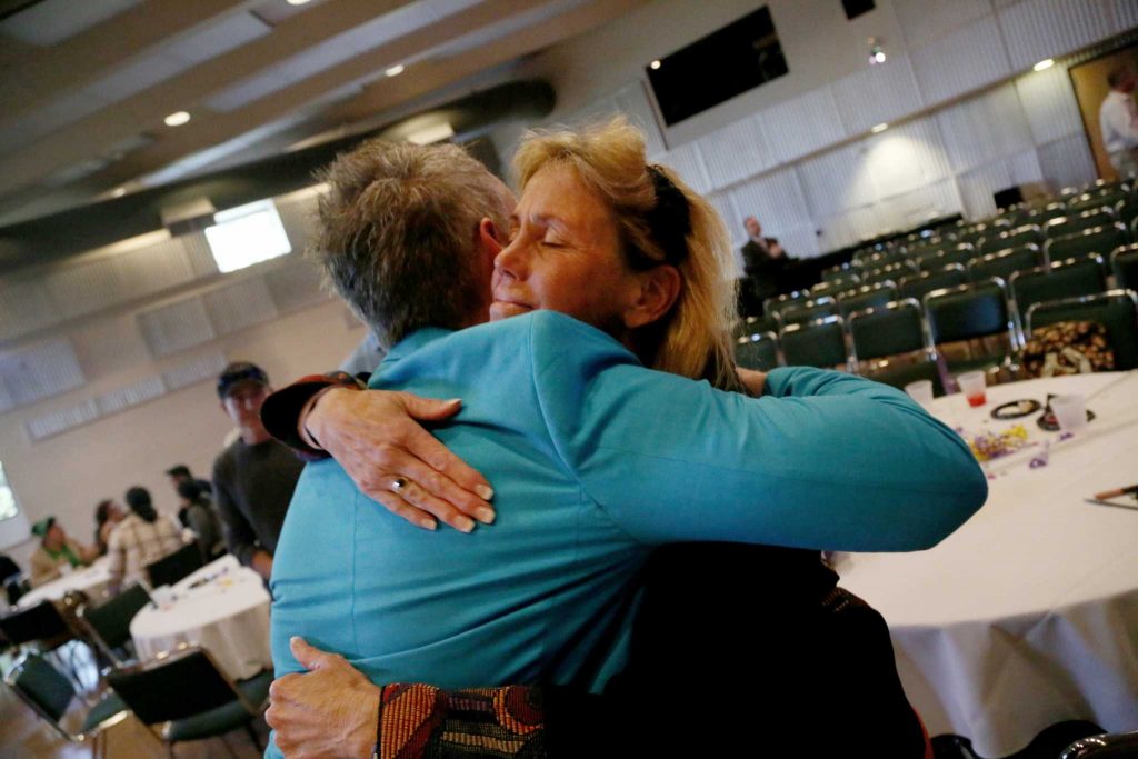 Outgoing Dean of Students Joseph Greenwall hugs Tina Marie Rossi, the aquatic fitness and wellness coordinator, at a farewell event in his honor in Jack Adams Hall in the Cesar Chavez Center at SF State Tuesday, April 22. Photo by Rachel Aston / Xpress