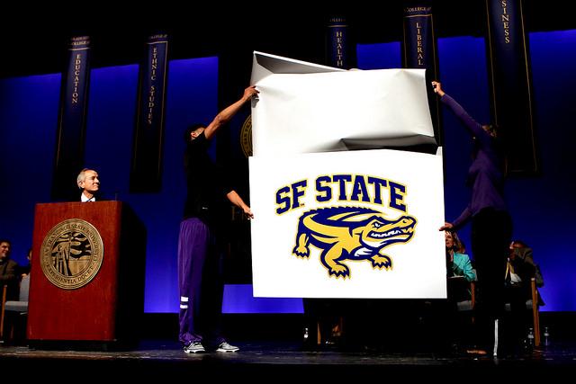 Udun Osakue and Jazmine Williams present the new SF State Gator mascot image at the Opening Faculty Meeting (2014-2015) at the McKenna Theatre Monday, August 25 at SF State.  