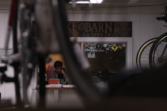 Tim Stone, third year, works the front desk at the Bike Barn at San Francisco State University in San Francisco, Calif. on Tuesday September 2, 2014. Stone has been working at the bike barn for a year now.