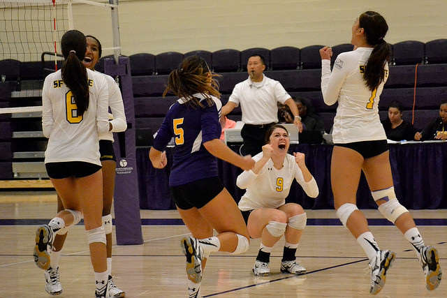 Jessica Nicerio (left), Melissa Horton (center) and Arianna Cruz (right) are ecstatic when the Gators score the winning point during a game against Cal State San Bernardino at The Swamp Friday night, Sept. 19. SF State beat the Coyotes 3-2.