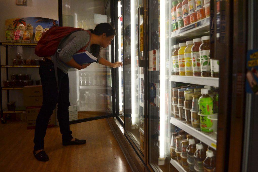 Thursday, Sept. 25, Hospitality and tourism major Amanda Hoang decides on a drink between classes at Healthy U in the Cezar Chavez Student Center.