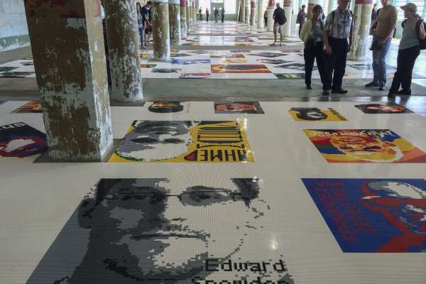 Alcatraz visitors observe Ai Weiwei's “Trace”, an art installation of over 175 portraits made entirely of LEGO, each face depicting a subject of political detainment, Saturday, Sept. 27, 2014. Jenna Feeley / Xpress.