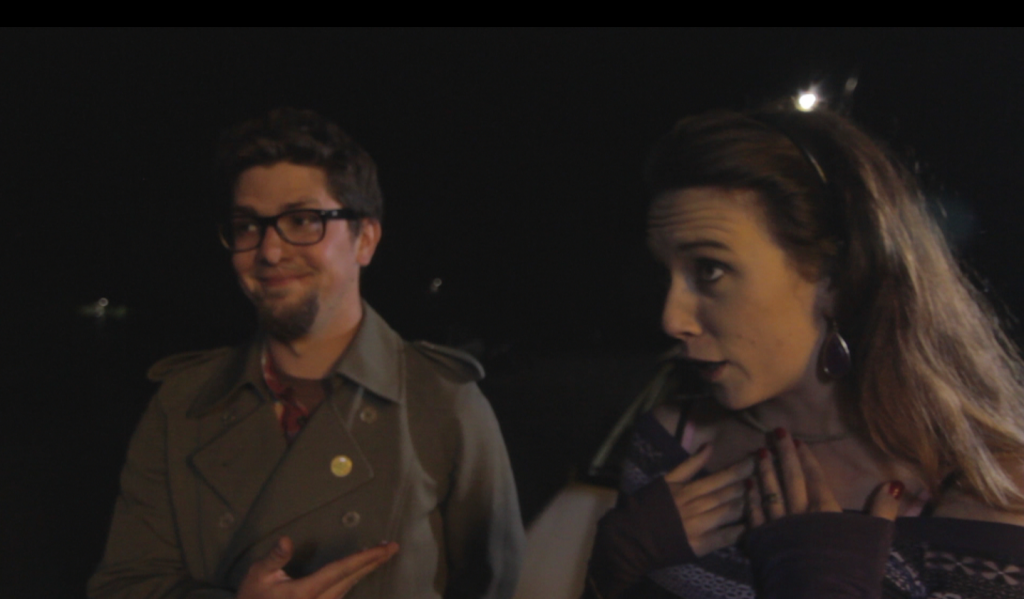 Characters Henry (Daniel Thibodeaux) and Laura (Kaitlin Clancey) get confrontational after a minor car accident in One Man Show, filmed by alum Jonathan Salazar.