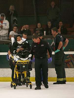 Brian Lu, #15, is led off the ice on a stretcher after he took a hard hit against the Santa Rosa JC Polar Bears at Snoopy's Home Ice on Friday, Oct. 3, 2014. Sara Gobets / Xpress.