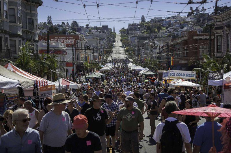 Fair attendees walk up and down the street while vendors sell merchandise at the Castro Street Fair in San Francisco Sunday, Oct. 5, 2014. Frank Ladra / Xpress.