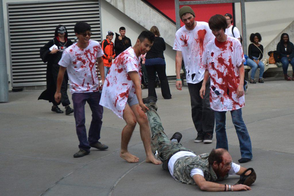 Thursday, Oct. 16, 2014, SF State improv troupe, Zombie Nation teamed up with Neighborhood Emergency Response Team volunteers to spread earthquake safety awareness at this year's Quake in the Quad. Here, the zombies pretend to rise from the 
dead, after apparently dying in an earthquake, due to not following safety protocol.
