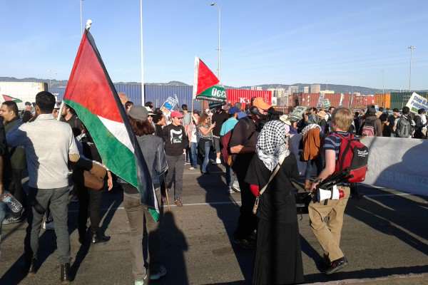 Pro-Palestinian demonstrators protest in front of the Port of Oakland shipyard in an effort to block Israeli cargo company Zim Integrated Shipping Services Ltd. Sunday, Oct. 26, 2014. Alma Villegas/Xpres.