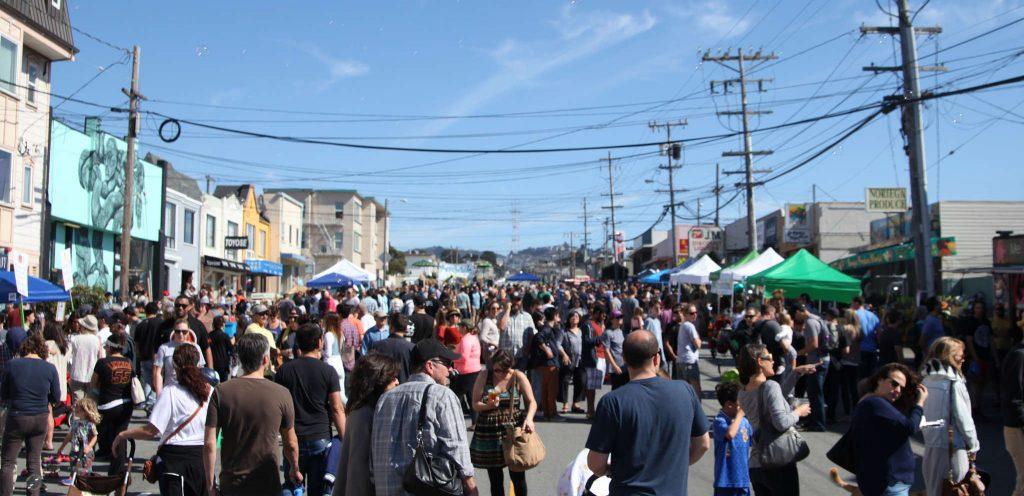 People, artists and vendors gather together on Noriega St. for the first annual Ocean Beach Music and Arts Festival Saturday, Oct. 11, 2014.