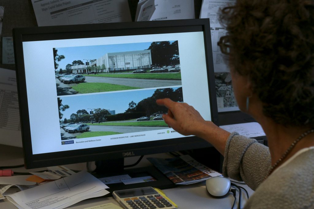 Wendy Bloom, Campus Planner points to a before and after illustration at her computer of the wellness center is being built at SF State at Font and Lake Merced Boulevards Monday, Oct. 13, 2014. The center will open in 2018, free for SF States and a fee for faculty. Amanda Peterson / Xpress.