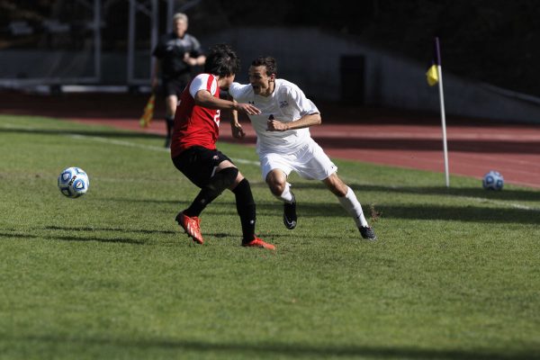 Gator Kevin Johnson, #4 senior, tries to keep the ball from Hawaii Hilo Vulcan Cristian Ruelas, #22 junior, in Cox Stadium at SF State Wednesday, Oct. 22, 2014. The SF State Gators beat the Hawaii Hilo Vulcans 1-0 in over time. Daniel Porter/Xpress.