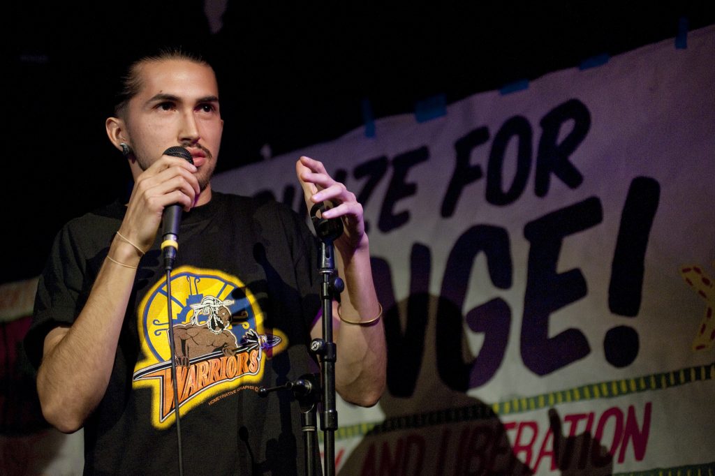 Michael Sanchez emcees the Mobilize For Change: Poetry, Unity, and Liberation event at the Depot on Thursday, April 17, 2015. (Sara Gobets / Xpress)