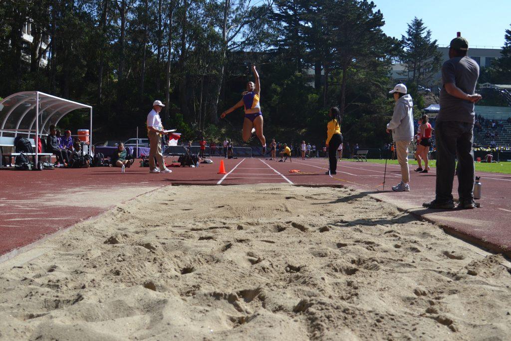 Graduating criminal justice major and record setting athlete, Hilary King, jumps 5.79 meters, in the long jump, taking first place at Cox Stadium Friday, April 3. She recently broke the Womens record at SFSU by jumping 5.79 meters. (Helen Tinna / Xpress)