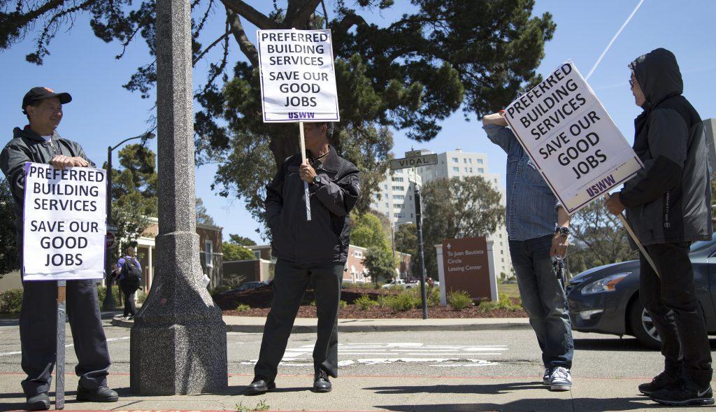 Villas Park Merced janitors and handymen picket around Park Merced on Wednesday April 15. They have been terminated and a new crew of janitors by a new contractor will be hired. (Emma Chiang  / Xpress)