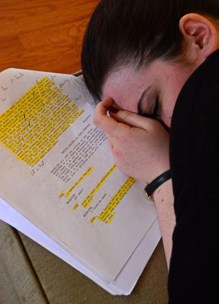 Theater major Jennifer Marte sleeps for her scene as a few of the cast members they rehearse Sunday, April 19. The upcoming play called “Puddles” will be performed at the Greenhouse Festival Saturday, April 25. (Katie Lewellyn / Xpress)