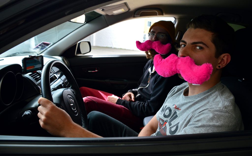 (from right) SF State student drivers Cody Lee, Lyft, and James Shumate, Lyft and Uber, sit in Lees car which he uses to pick up passengers for work Monday, April 4. (Katie Lewellyn / Xpress)