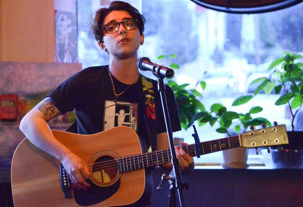 Ryan Cassata performs two songs at the Sacred Grounds Cafe open mic on Thursday April 9. (Melissa Minton / Xpress)