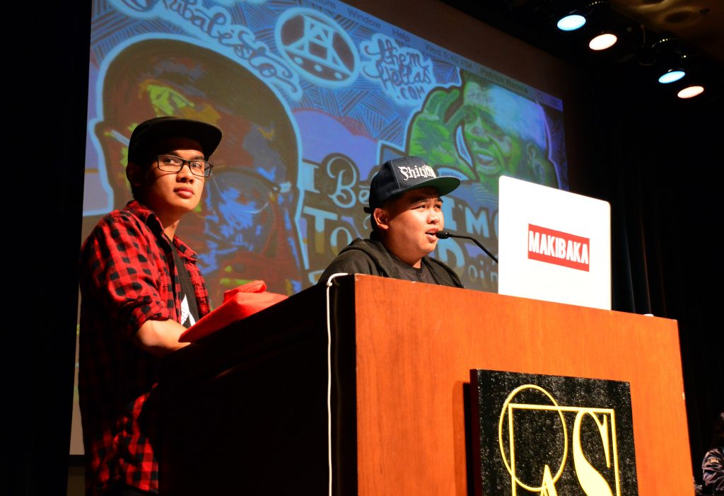 SF States League of Filipino students (FLS) Aaron Agudelo (left) and Patrick Racela (right), begin the 12th Annual Filipino Mural event inside the Jack Adams Hall on campus, April 8, on Wednesday evening (Katie Lewellyn / Xpress)