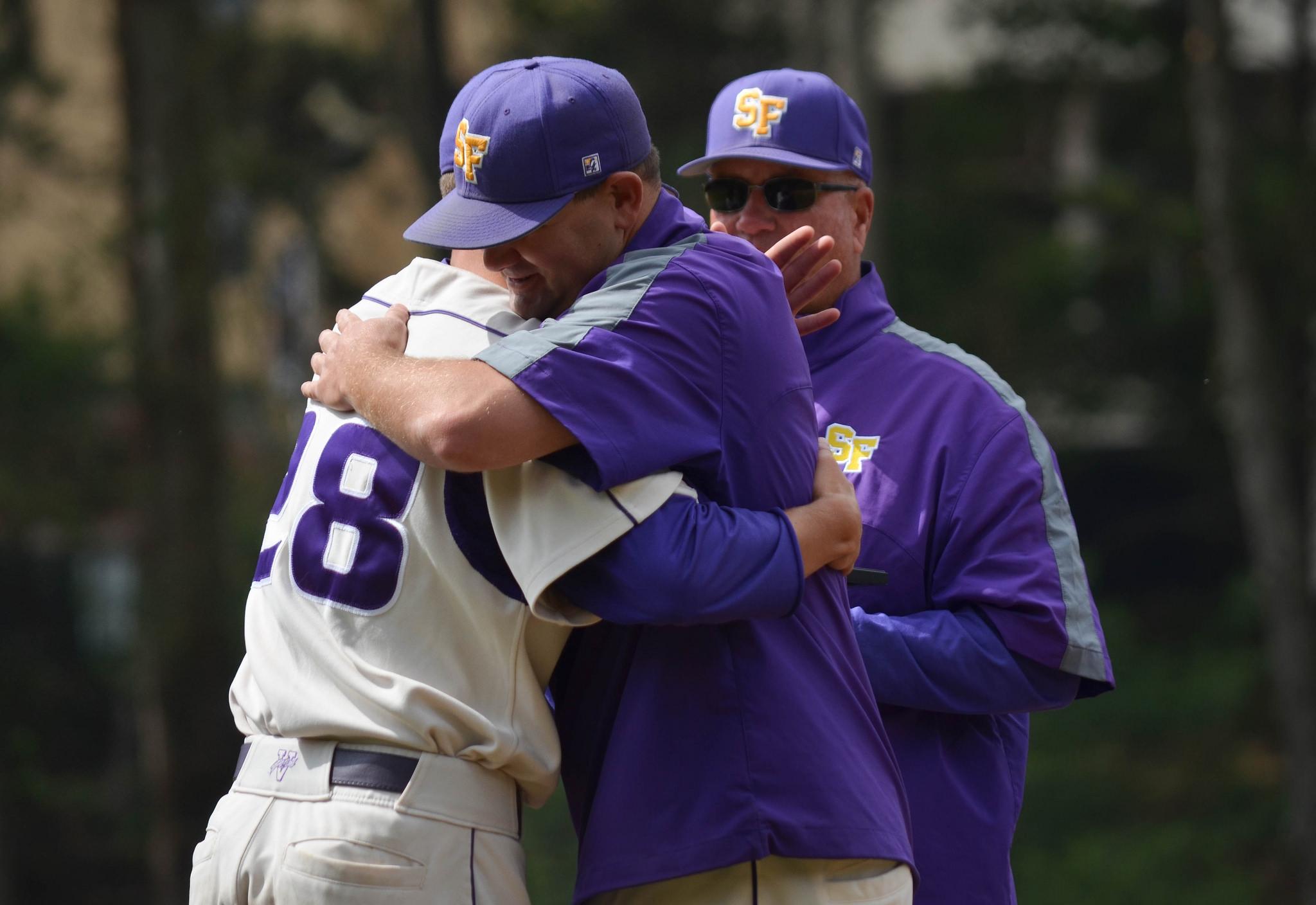SF State senior gator Cory Davis (28) hugs the SF State baseball coaches during the senior ceremony before the game against Cal Poly Pomona at Maloney Field Sunday, May 3. (Melissa Minton / Xpress)