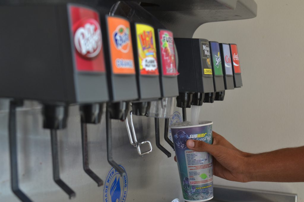 A student fills up his soda at the SF State campus Subway, located in the village Tuesday, May 12. University Corporation is seeking a beverage company to partner with to retain pouring rights on campus. (Helen Tinna / Xpress)