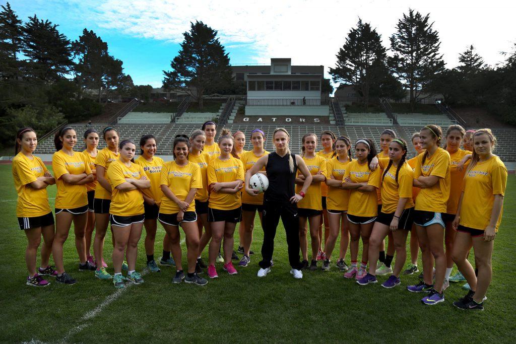 Tracy Hamm, SF States new Head Womens Soccer Coach is the second in the 33-years, succeeding Jack Hyde. Hamm poses with the team at Cox Stadium Monday, Feb. 2, 2015. (Emma Chiang / Xpress)
