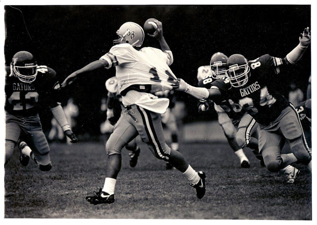 Defensive end Harry Overstreet II (84), SF State alumnus and former Gator football player tackles UC Santa Barbara Gauchos quarterback at Cox Stadium on Aug. 24, 1988. SF State lost with a final score of 6-16. (Photo Courtesy of Harry Overstreet II)
