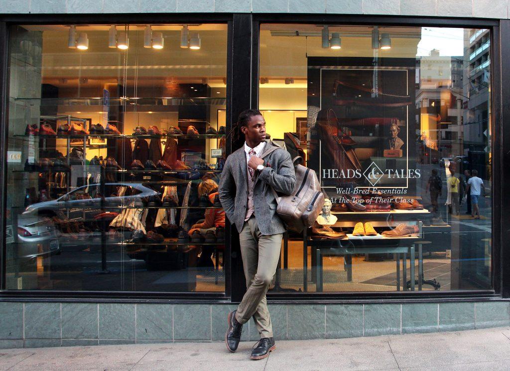 Bryce Jones, a marketing student at SF State and fashion connoisseur, poses in front of Johnston & Murphy, a quality mens and womens shoe and clothing  store after work in Union Square Friday, Sept. 18. (Alex Kofman / Xpress)