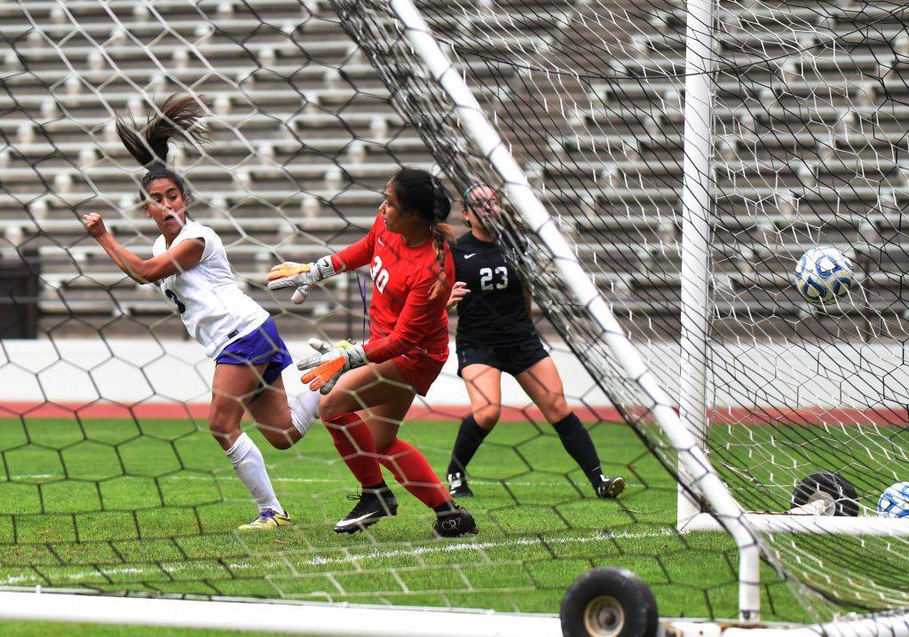 Danielle Vidal (3), midfielder for SF State Gators, heads the ball to score the first goal during the first half against Holy Names University Hawks at Cox Stadium at SF State Tuesday, Sep. 22. SF State Gators won 5-1. (Xpress / Qing Huang)