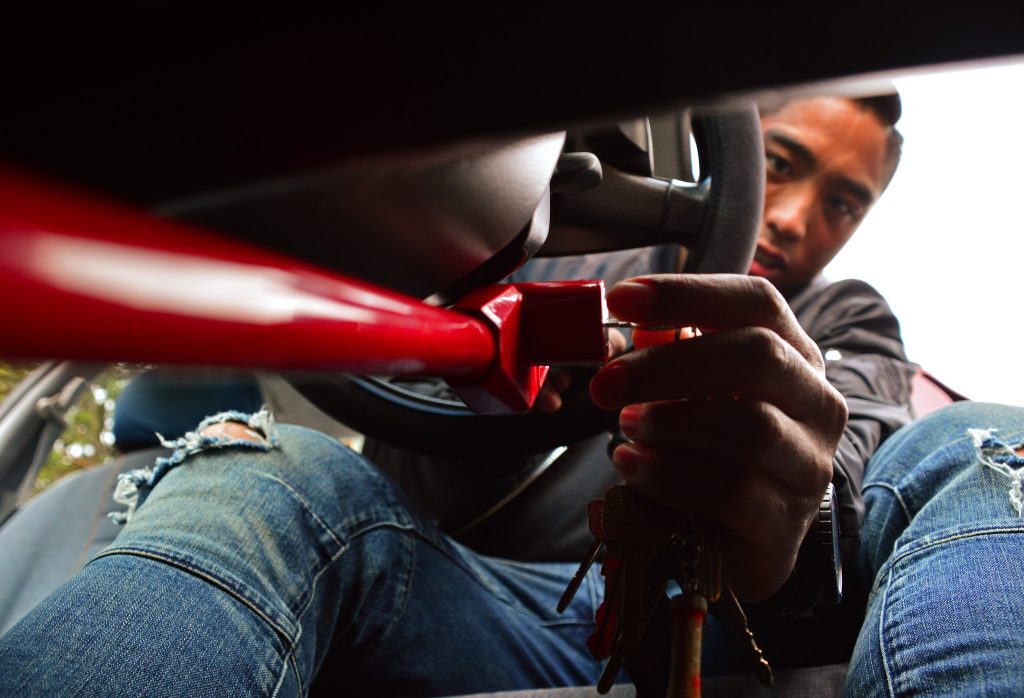 SF State biology teaching associate, Michael Cala, is applying his pedal break in his sisters vehicle to get around while his car is being repaired in a shop on Monday afternoon, Lake Merced Blvd., Daly City, September 28, 2015 (Katie Lewellyn / Xpress)
