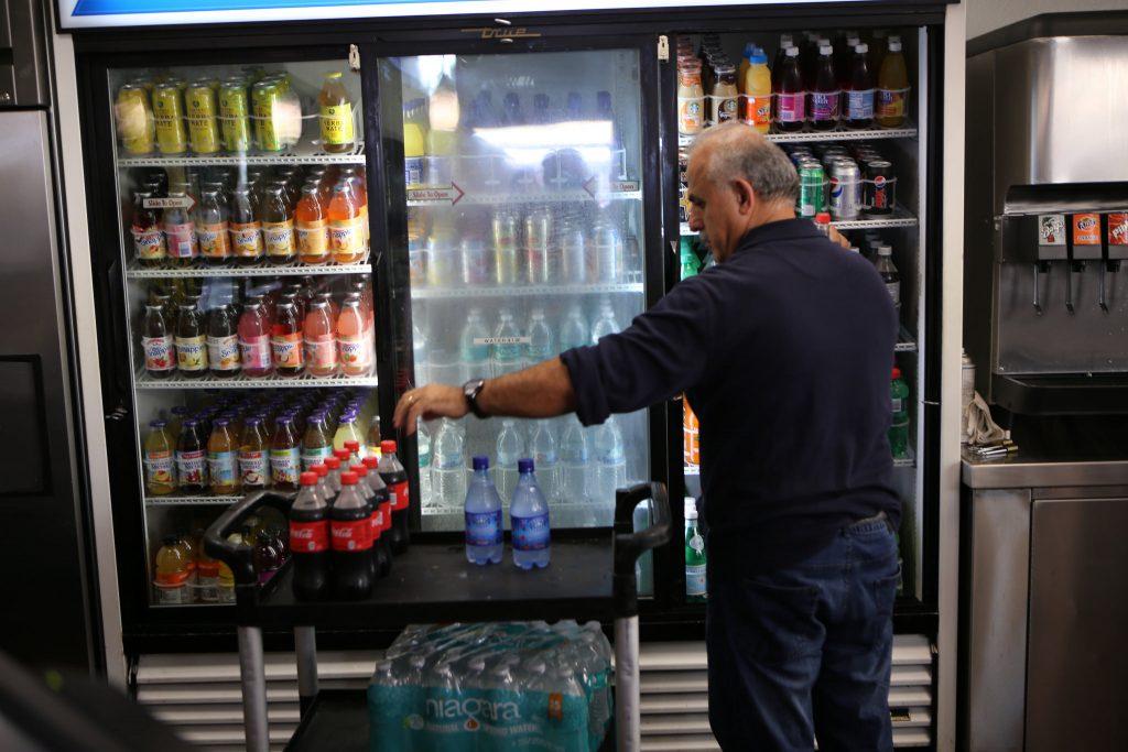 Nazih Ibrahim, a Gold Coast Grill & Catering employee, restocks beverages in the Gold Coast Grill & Catering vendor store at SF State Friday Oct. 2. The University Corporation (UCorp) is looking to establish an exclusive partnership with SF State regarding pouring rights to beverages on campus according to UCorps recent proposal. (Joel Angel Juárez / Xpress)