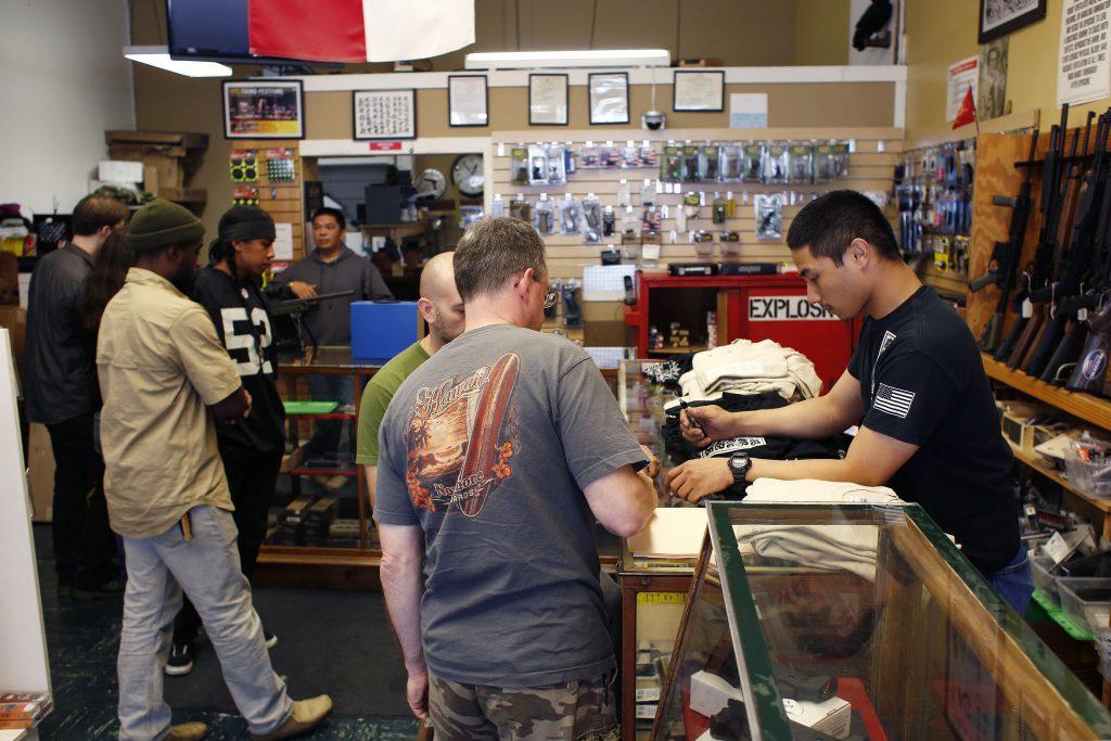 Customers visit Higher Bridge Arms Inc., the last gun shop in San Francisco Sunday, Oct. 4, 2015. The store located in the Mission District will be permanently closing Oct. 31 due to the citys political climate of increased gun control regulations. (Emma Chiang / Xpress)