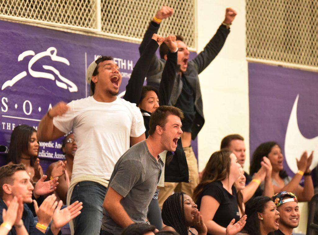David Tui, left, and other fans cheer for SF State Gators during the game won 3-1 against Cal State East Bay Pioneers at the Swamp at SF State Saturday, Sep. 19. (Qing Huang / Xpress
