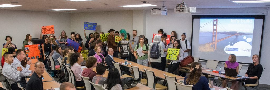 Students oppose the sale of pouring rights at SF State by disrupting a town hall meeting  with Coca-Cola, a potential company that may begin supplying all beverages on campus Wednesday, Oct. 14, 2015. (Brian Churchwell / Xpress)