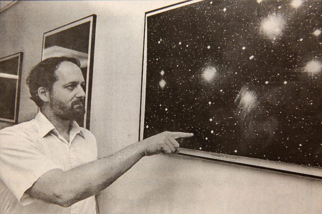 Geoff Marcy, professor of physics and astronomy, is part of a team which discovered a brown dwarf star near Pleides Cluster. Marcy is pointing to the area of detail where the dwarf is located. Photo by Edmund Lee for the Golden Gator published on August 31, 1995. 
