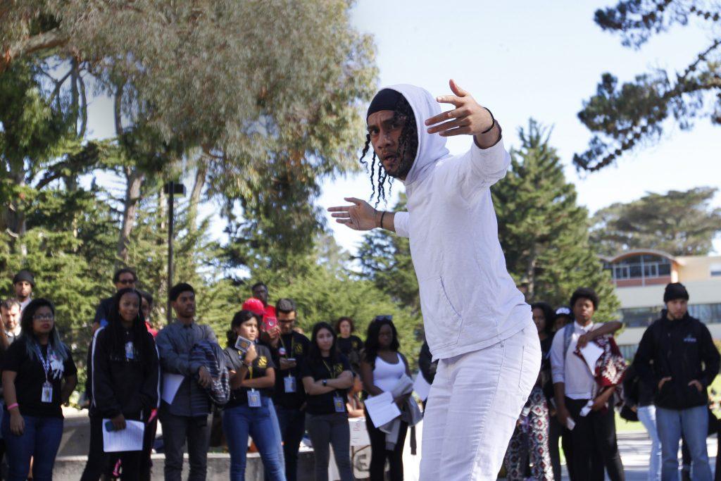 Spencer Pulu, 23, Race & Resistance Dance Major, performs his dance piece Black vs. Blue at the Speak Out student rally in the Cesar Chavez Quad Tuesday, Oct. 20, 2015. (Angelica Ekeke / Xpress)