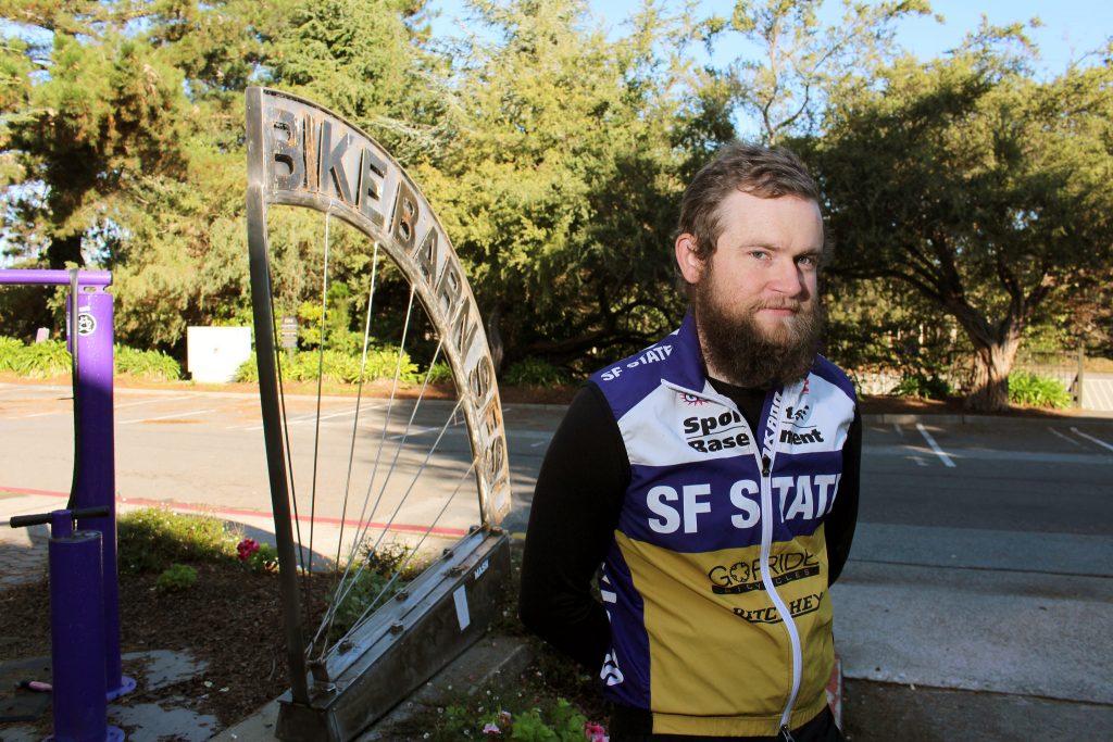 Nolen Brown, a member of the SF State Cycling team had his race bike stolen the weekend of Oct. 27 and 28. Brown poses for a portrait in front of the bike barn Tuesday, Nov. 3, 2015. (James Chan / Xpress)